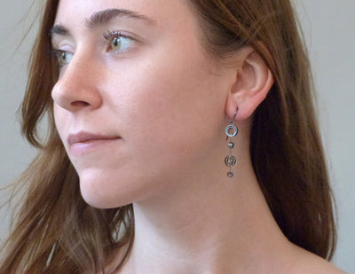 Slice oxidized earrings on model